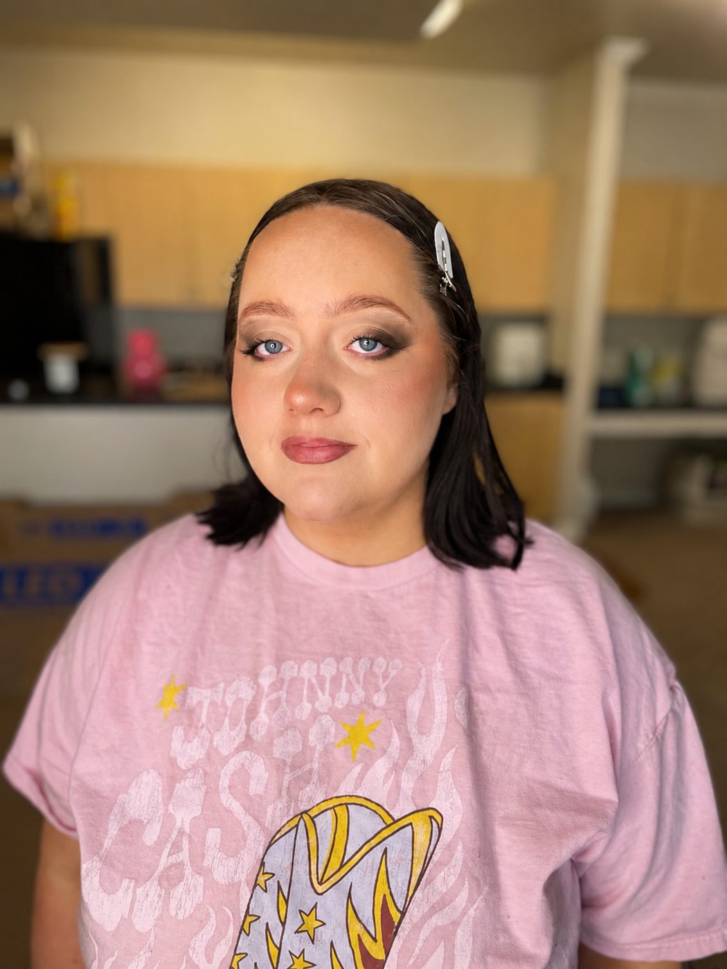 Smoky eye glam makeup with defined liner and a soft mauve lip